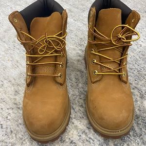 Brand New Timberland boots size 4 without tags. Tiny stain- on one boot.